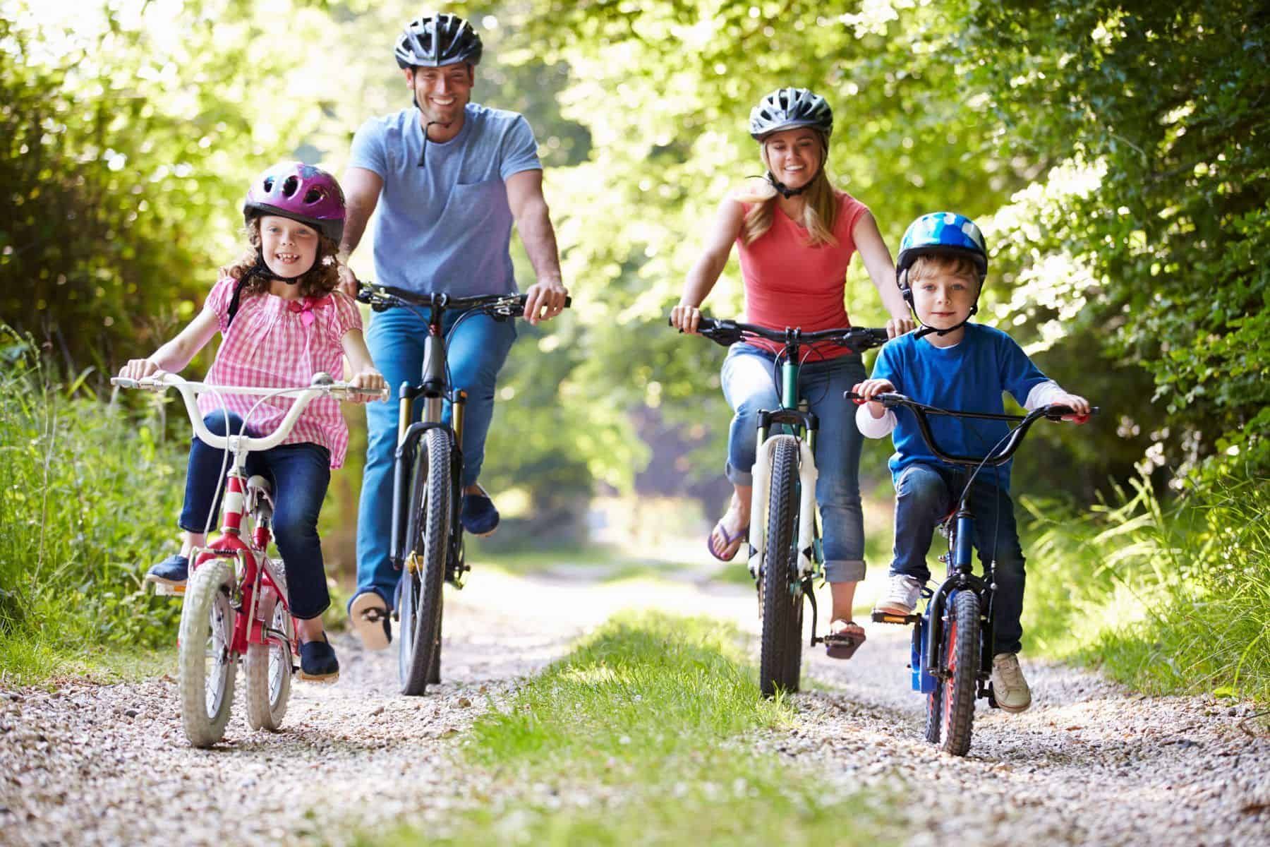 Family cycling together outdoors — active wellness and recovery services in Early, Texas